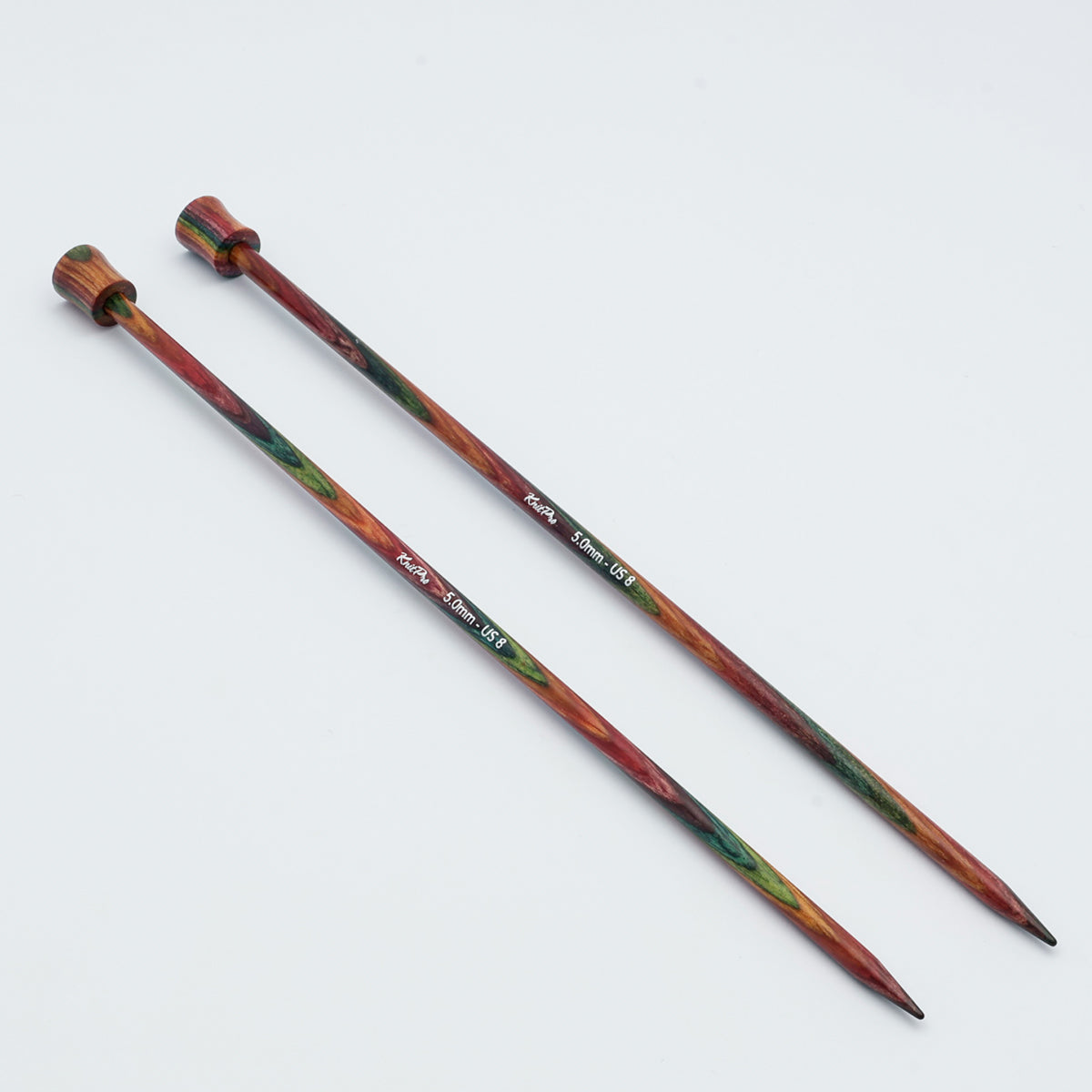 KnitPro Symfonie 2 single pointed knitting needles, 30 cm - Two wooden knitting needles with a colorful, marbled pattern of red, green, and brown, displayed diagonally on a plain white background.