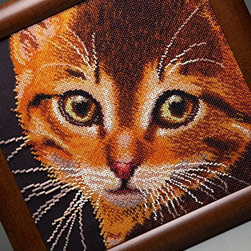 Close-up of detailed beadwork featuring a playful red kitty.