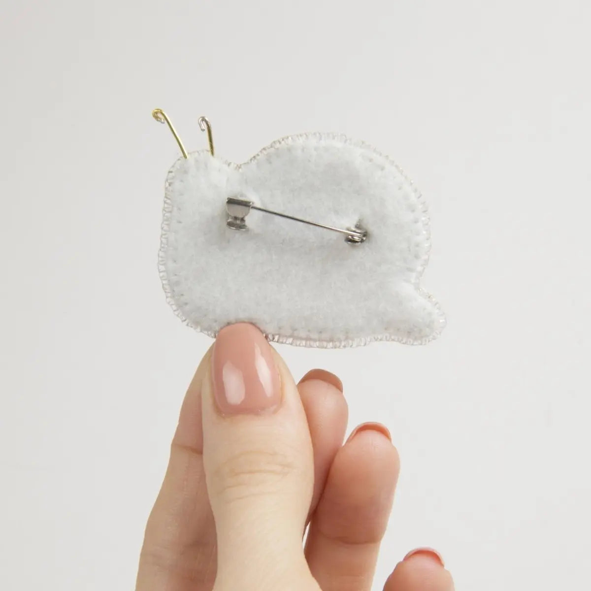 Beadwork kit for a glittering Crystal Art Snail brooch.