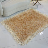 Circulo Natural Luxury Decor - Fluffy Yarn, 180 m / 280 g - Beige rug on a tiled floor with a white chair in the background