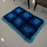 Circulo Natural Luxury Decor - Fluffy  Effect Yarn, 180 m / 280 g - Blue textured rug on a white tiled floor