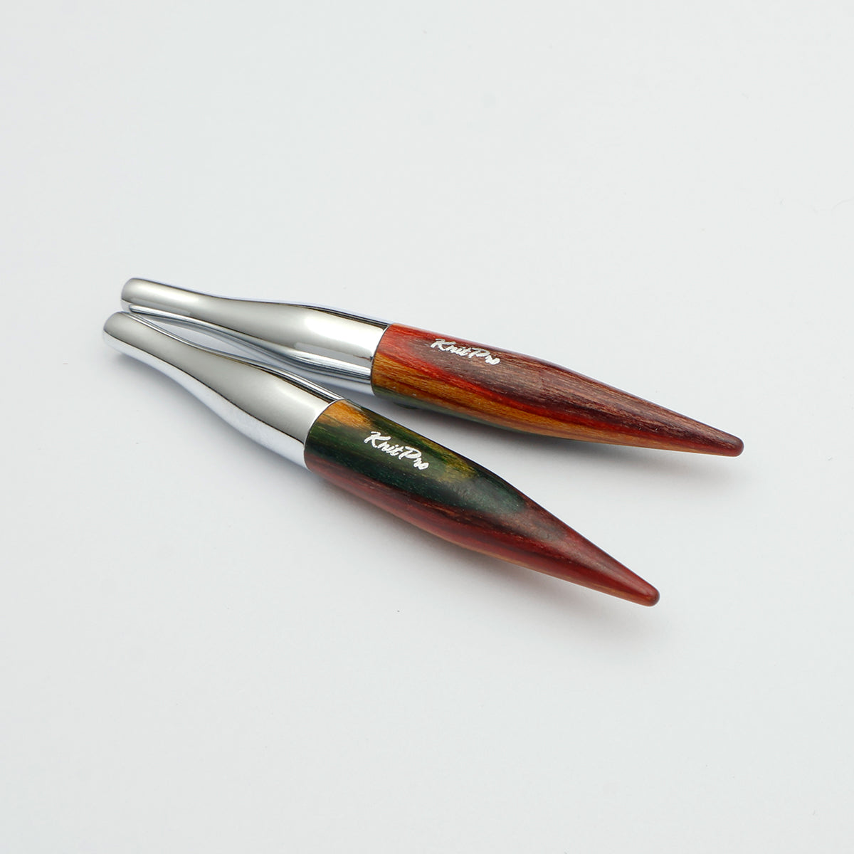 KnitPro Symfonie 2 Mini interchangeable needle tips, 5 cm - Two pointed wooden tools with silver metal collars, displayed diagonally on a clean white background. The wood features a marbled pattern of reddish-brown, dark brown, and green, with the brand name 'Ralph Lauren' printed in white script.