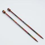 KnitPro Symfonie 2 single pointed knitting needles, 30 cm - Two wooden knitting needles with a colorful, marbled pattern of red, green, and brown, displayed diagonally on a plain white background.