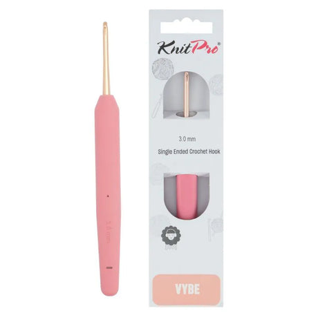 KnitPro Vybe Single Crochet Hook 3mm - A pink single-ended crochet hook with a gold-toned tip shown next to its retail packaging. The packaging is white with a clear window displaying the hook and features the KnitPro brand and the name 'VYBE' at the bottom.
